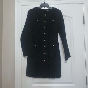 Black tweed dress with gold buttons.